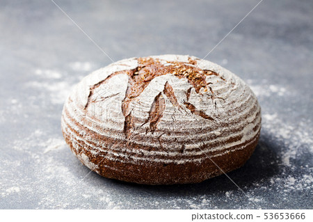 Bread rye, whole grain on a grey background. Copy space. Bread rye, whole grain on a grey background. Copy space. 53653666