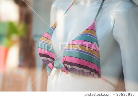closeup of pink tripped bikini on mannequin  53653953