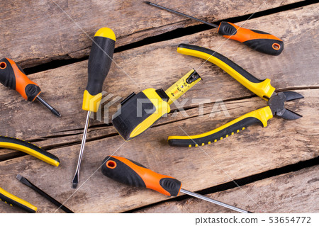 Set of hand construction tools on wooden background. 53654772