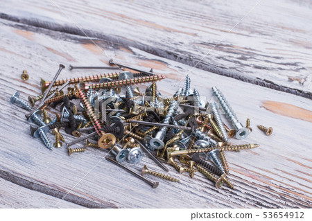 Close up heap of various screws. 53654912