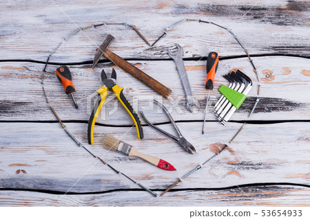 Various construction tools on wooden background. Various construction tools on wooden background. 53654933