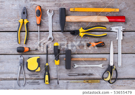 Construction tools on wooden background. 53655479