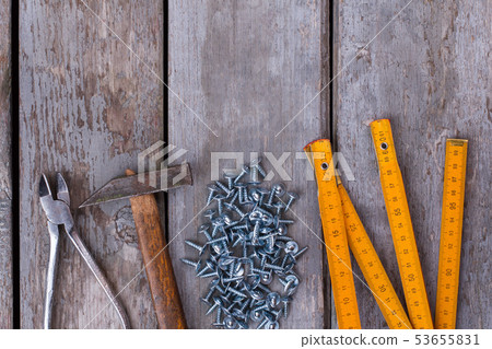 Set of carpenters tools on wooden background. 53655831