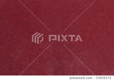 Red rough textured sandpaper background. 53656172