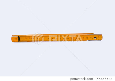 Yellow folding ruler isolated on white background. Yellow folding ruler isolated on white background. 53656328