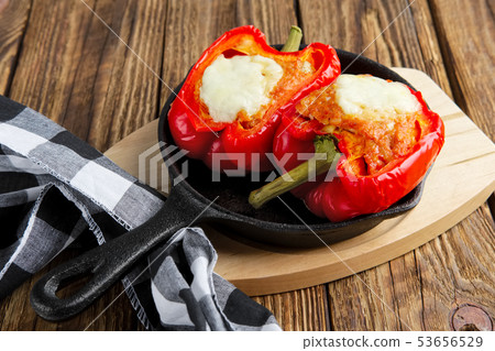 Bell pepper stuffed with meat with melted cheese 53656529