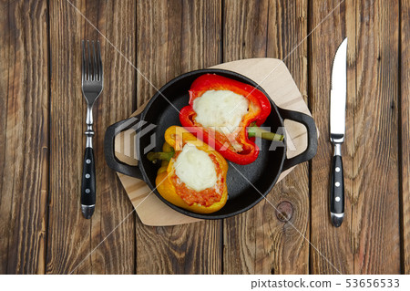 Bell pepper stuffed with meat with melted cheese 53656533