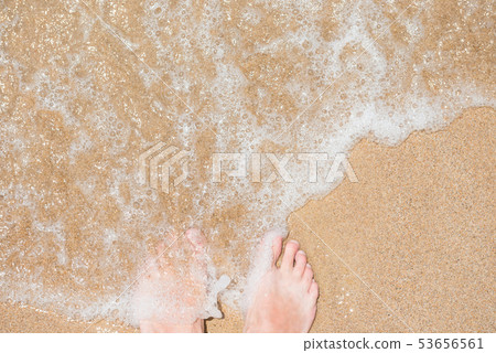 Bare human feet on sand beach 53656561