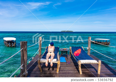 woman vacations indian ocean seascape Unguja Zanzibar Island Tanzania Africa 53656792