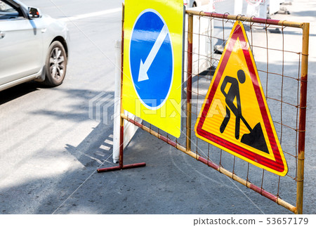 Keep left road sign at the city street Keep left road sign at the city street 53657179