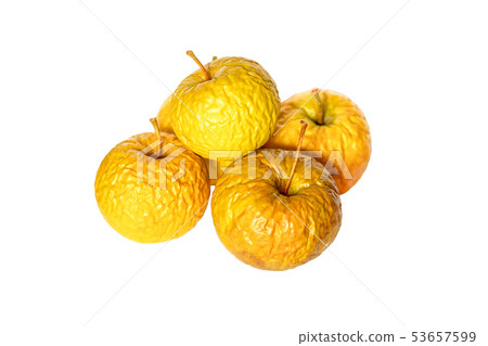 Wrinkled yellow old apples isolated on white 53657599