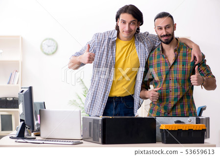 IT engineers working on hardware issue IT engineers working on hardware issue 53659613