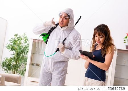 Young professional contractor doing pest control at flat Young professional contractor doing pest control at flat 53659789