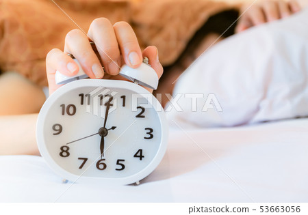 Alarm clock that wakes up in the morning 53663056