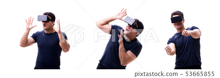 Young handsome man wearing virtual reality VR glasses isolated o Young handsome man wearing virtual reality VR glasses isolated o 53665855