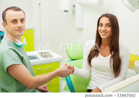 Patient in dentistry. Pretty woman visiting her dentist in clinic 53667002