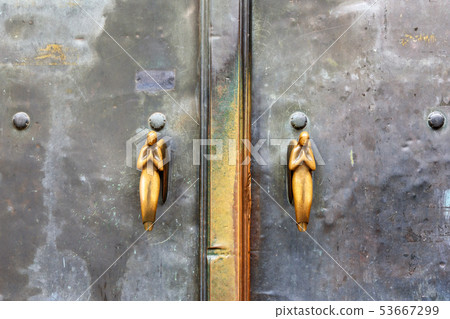 Holding Angels on door of St. Michael's Church. 53667299