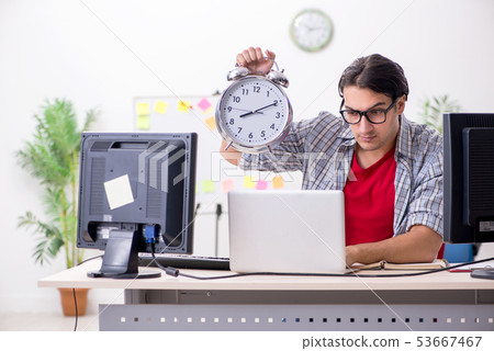 Male it specialist working in the office  53667467