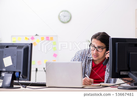 Male it specialist working in the office Male it specialist working in the office 53667481