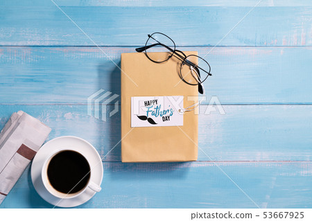 Happy Fathers Day, gift box with a cup of coffee Happy Fathers Day, gift box with a cup of coffee 53667925