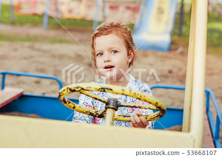 the child plays on the Playground 53668107
