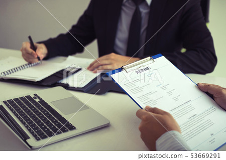 Manager is writing personal information of the Manager is writing personal information of the 53669291