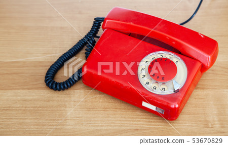 red retro phone on the table red retro phone on the table 53670829