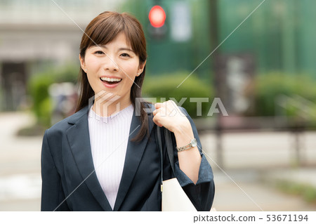 Business woman in office district Tokyo city Japanese woman Business woman in office district Tokyo city Japanese woman 53671194