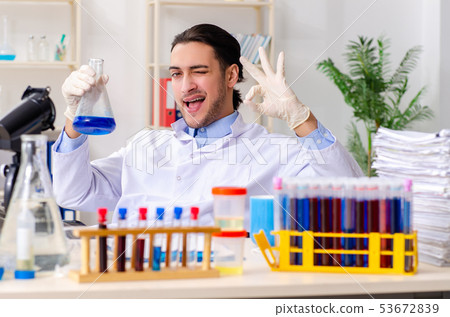 Young male chemist working in the lab Young male chemist working in the lab 53672839