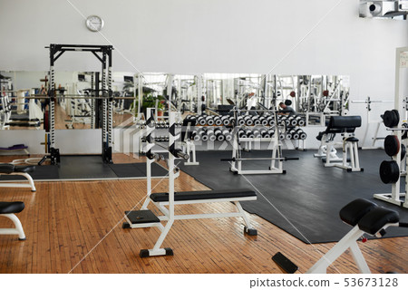 Gym interior with equipment. 53673128
