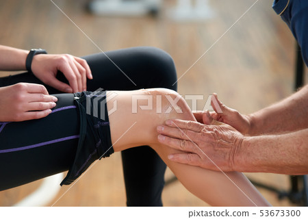 Injured female leg during fitness exercise. 53673300