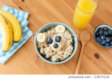 Kids breakfast oatmeal porridge in shape of bear Kids breakfast oatmeal porridge in shape of bear 53674126