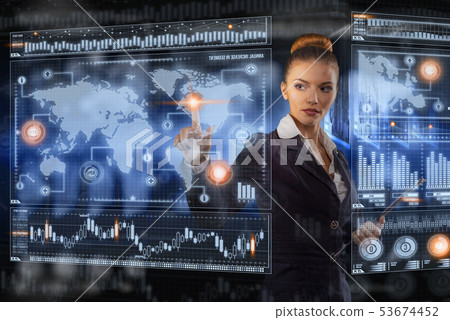 Young business lady works with virtual graphic interface in futuristic office 53674452