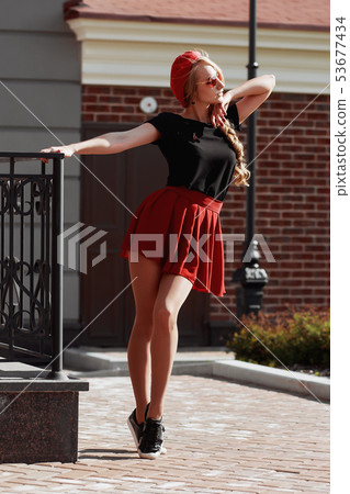 Portrait of beautiful young blonde woman wearing 53677434