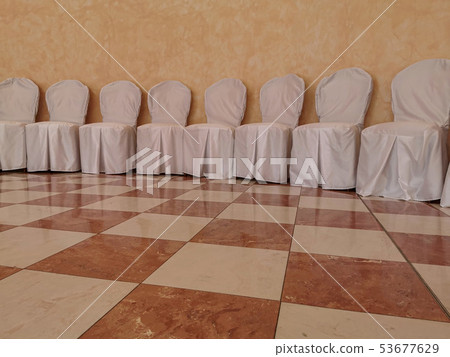 many wedding white covered chairs 53677629