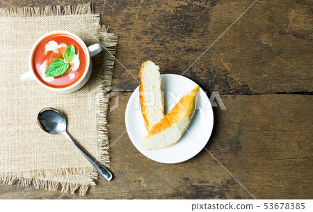 Tomato soup and baguette bread Tomato soup and baguette bread 53678385