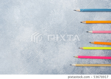 Bright colored pencils on the grey table. concept Bright colored pencils on the grey table. concept 53678917