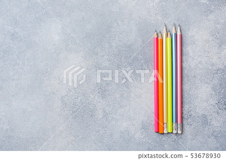 Bright colored pencils on the grey table. concept Bright colored pencils on the grey table. concept 53678930