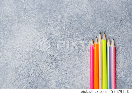 Bright colored pencils on the grey table. concept Bright colored pencils on the grey table. concept 53679108