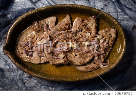 higado encebollado, a spanish recipe of cow liver. 53679795