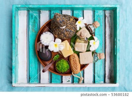 Spa and wellness massage setting. Colorful wooden background. Top view. Copy space. 53680182