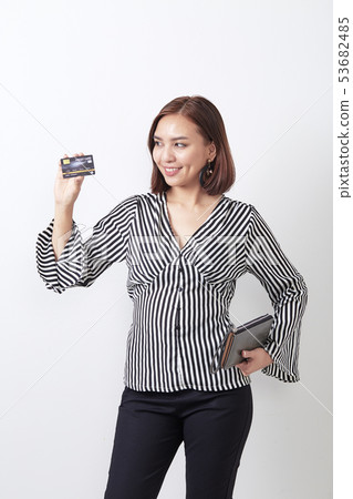 Asian woman holding credit card Asian woman holding credit card 53682485