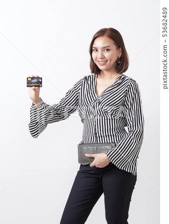 Asian woman holding credit card 53682489