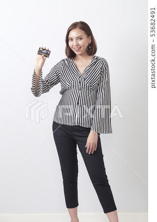 Asian woman holding credit card 53682491