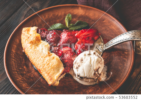 Slice of strawberry galette with ice-cream Slice of strawberry galette with ice-cream 53683552