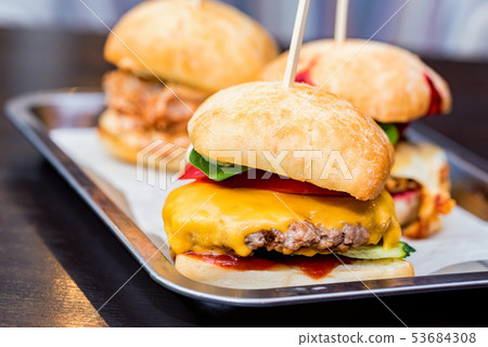 Close up three tasty burgers with different filling served on tray 53684308