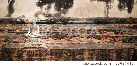 Ancient Buddha statues placed on brick walls Ancient Buddha statues placed on brick walls 53684415