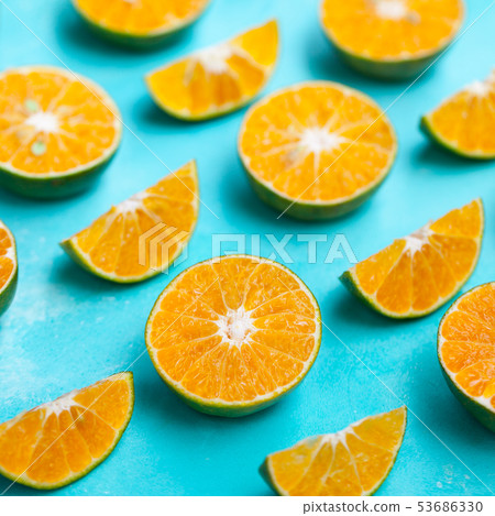 Oranges on blue background. Flat lay composition. Close up. Oranges on blue background. Flat lay composition. Close up. 53686330