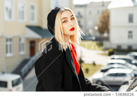 Beautiful young blonde girl with red lips Beautiful young blonde girl with red lips 53686816