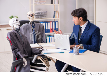 Funny business meeting with boss and skeletons 53687459